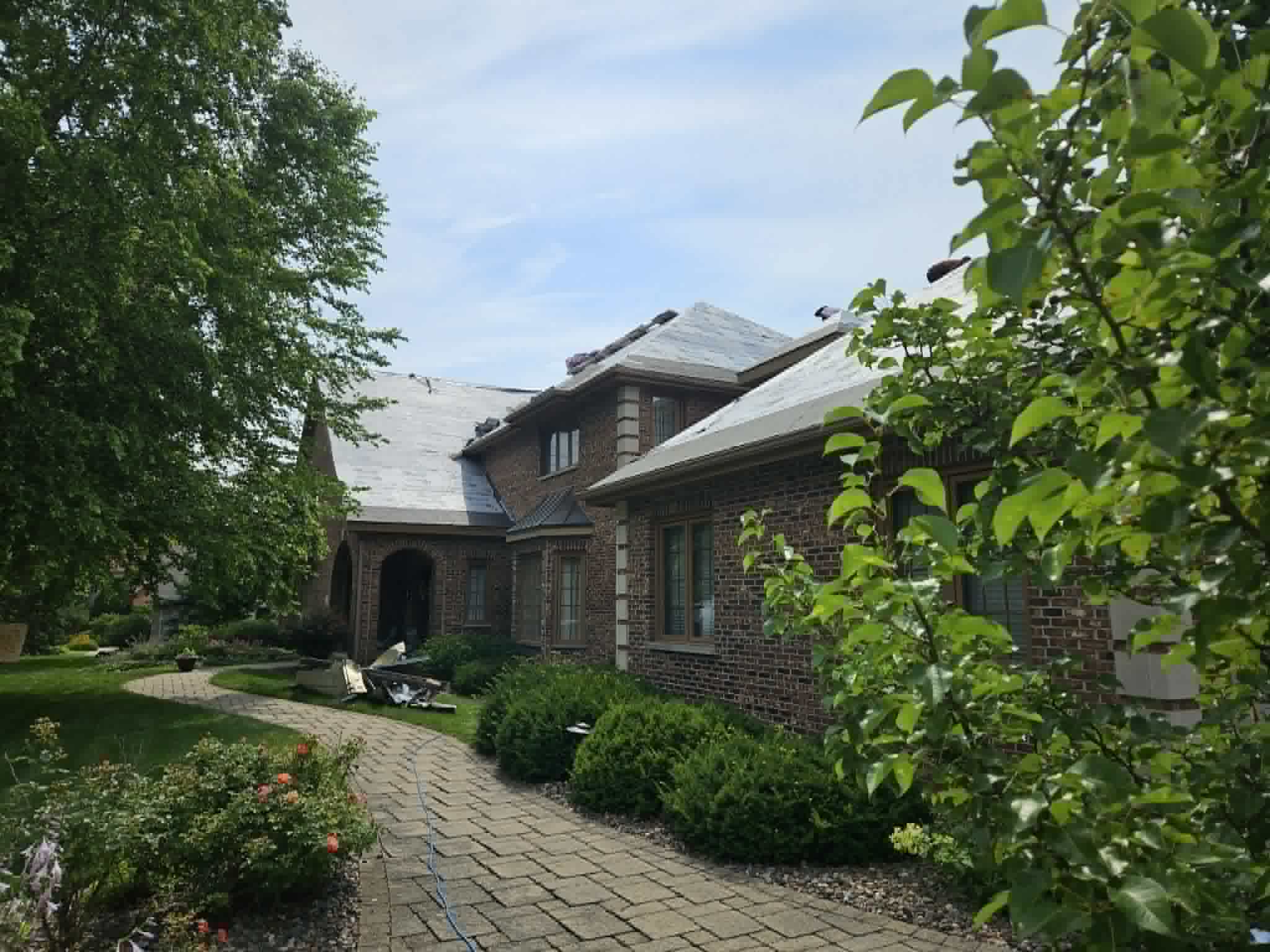 During work — chimney repair project by Chimneys Plus Roofing & Exteriors in Madison, WI